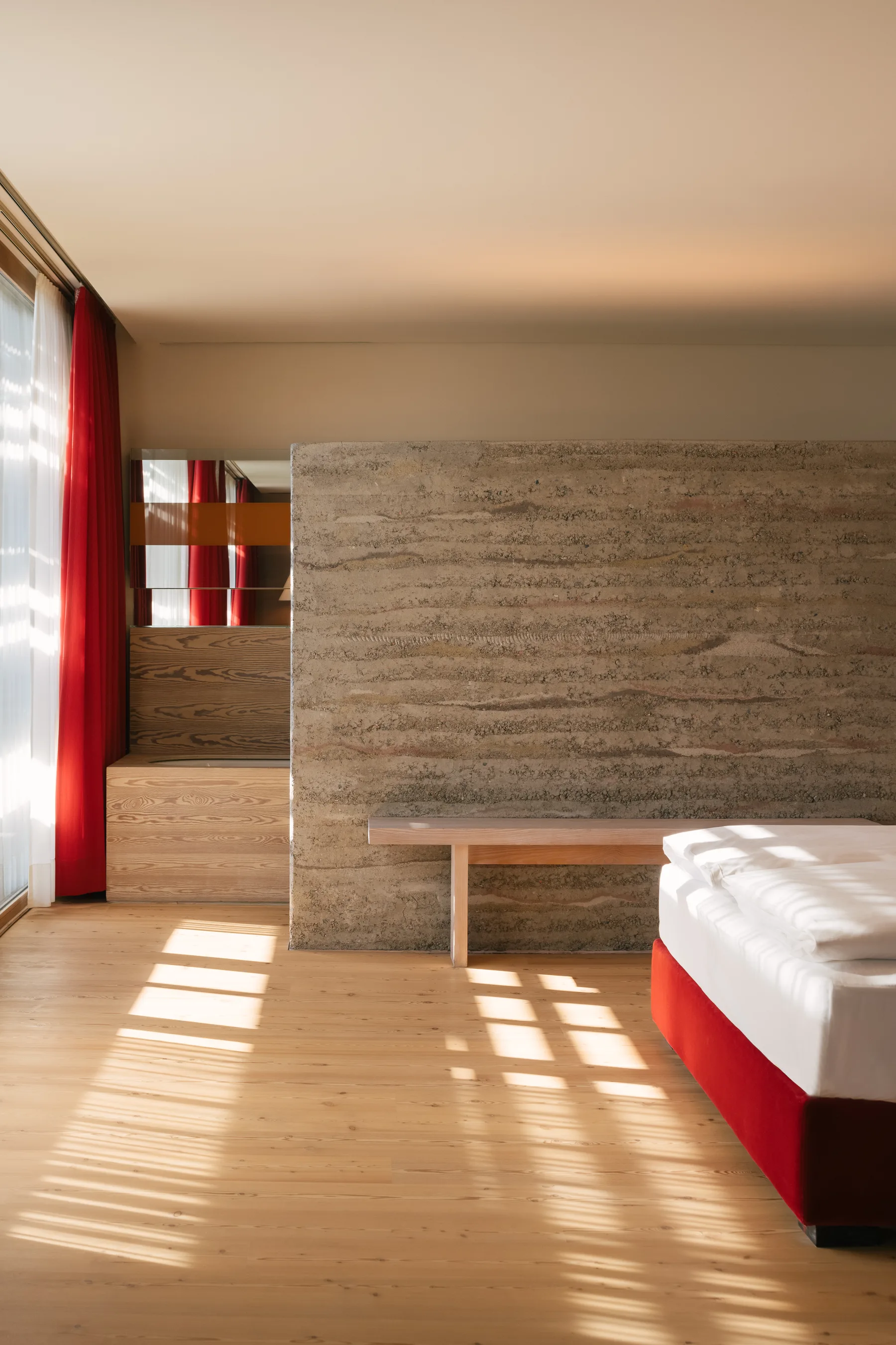 Guest room with large glass front and soft light at vigilius mountain resort.