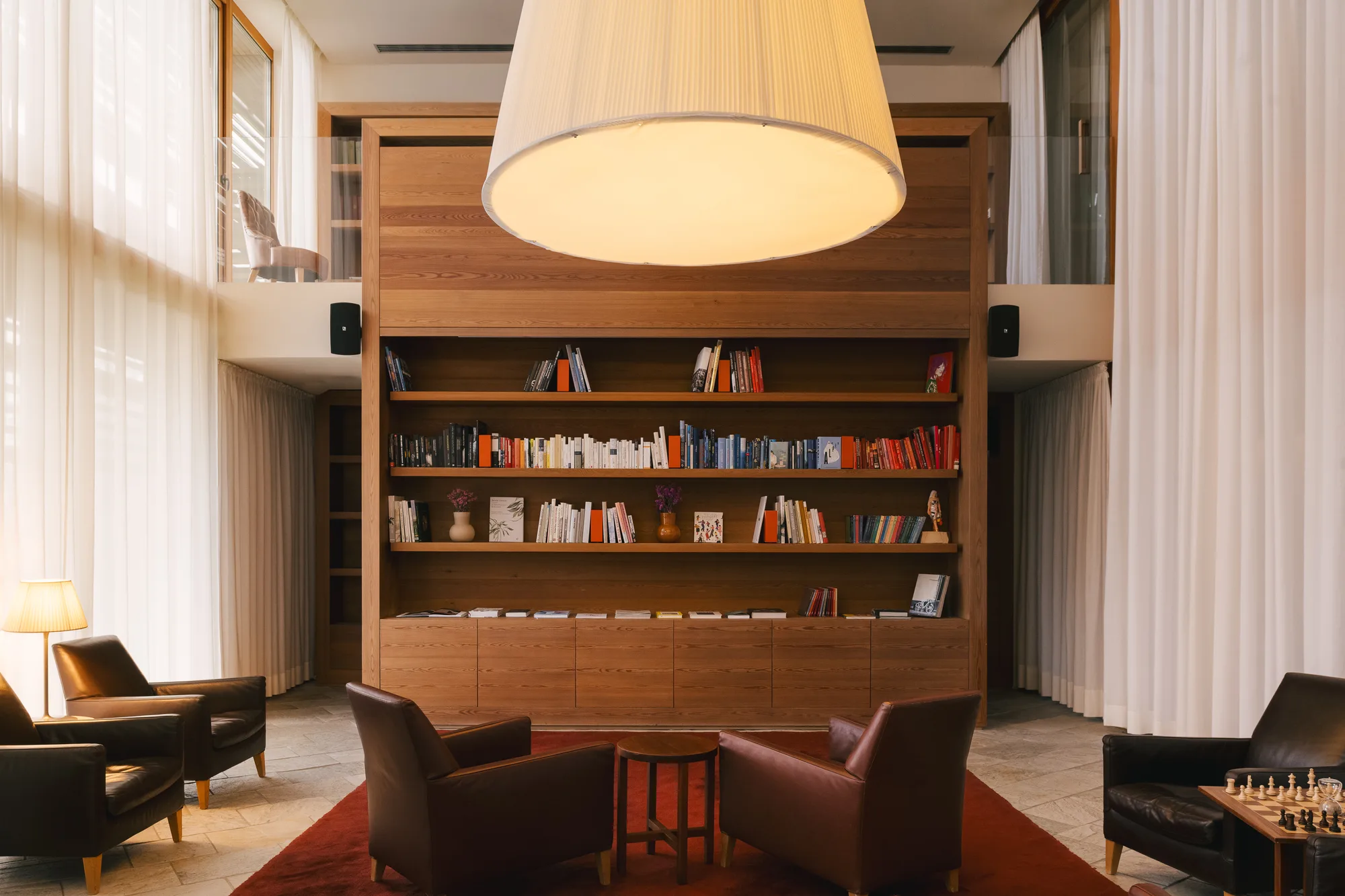 Library with larch wood and soft light at vigilius mountain resort.