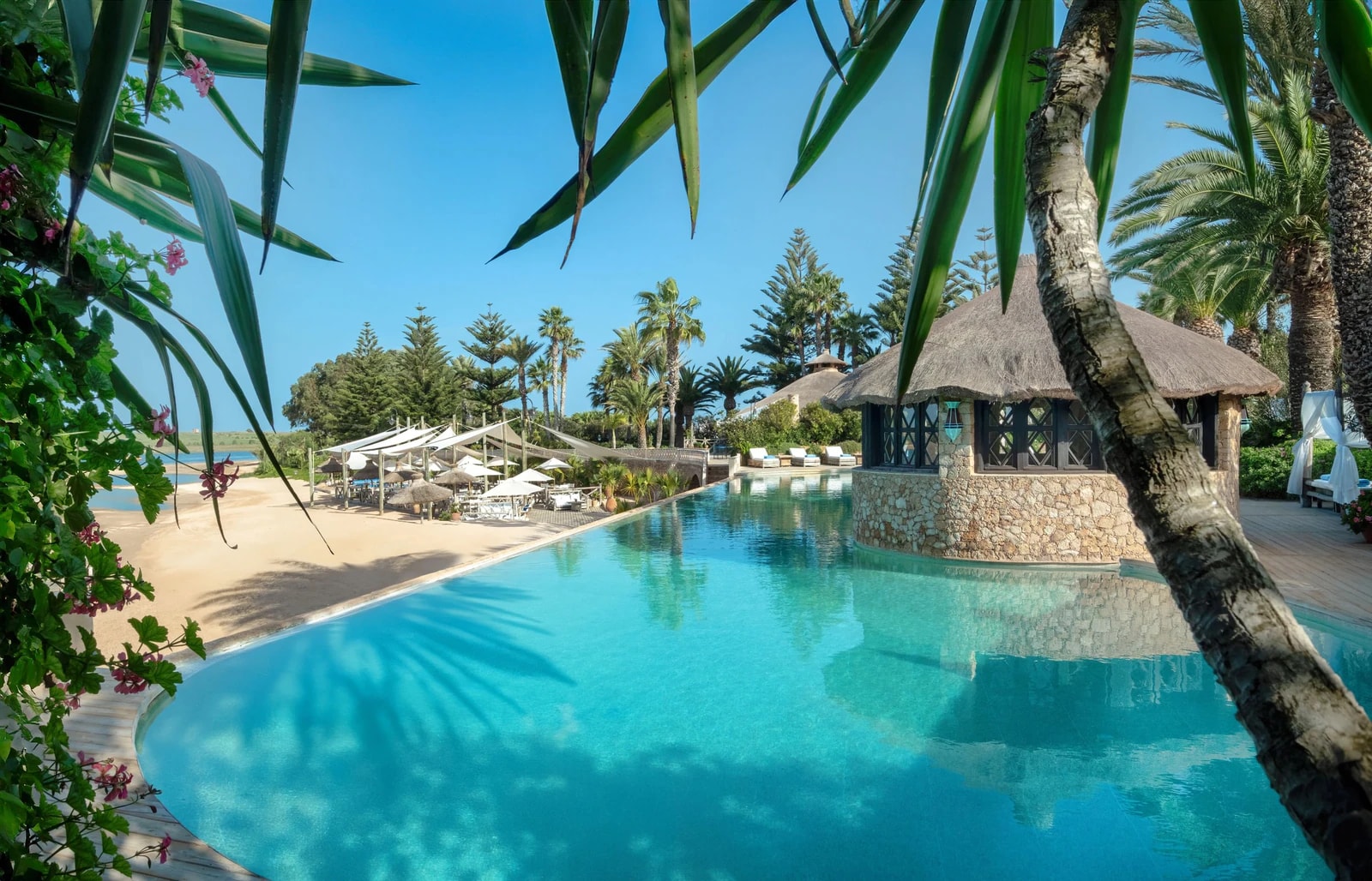 La Sultana's pool, with the beach and lagoon beyond. Staying here puts the calm water right on your doorstep. Photo: La Sultana Oualidia
