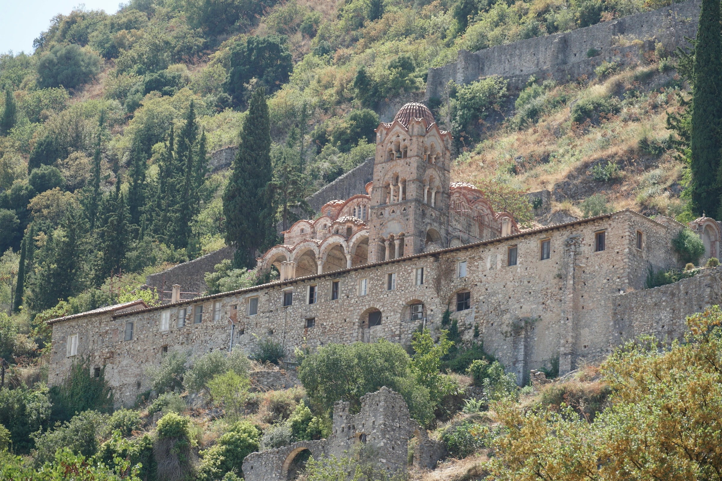 A Byzantine monastery on the wooded slopes of Mystras. Photo: Sheila C / Unsplash