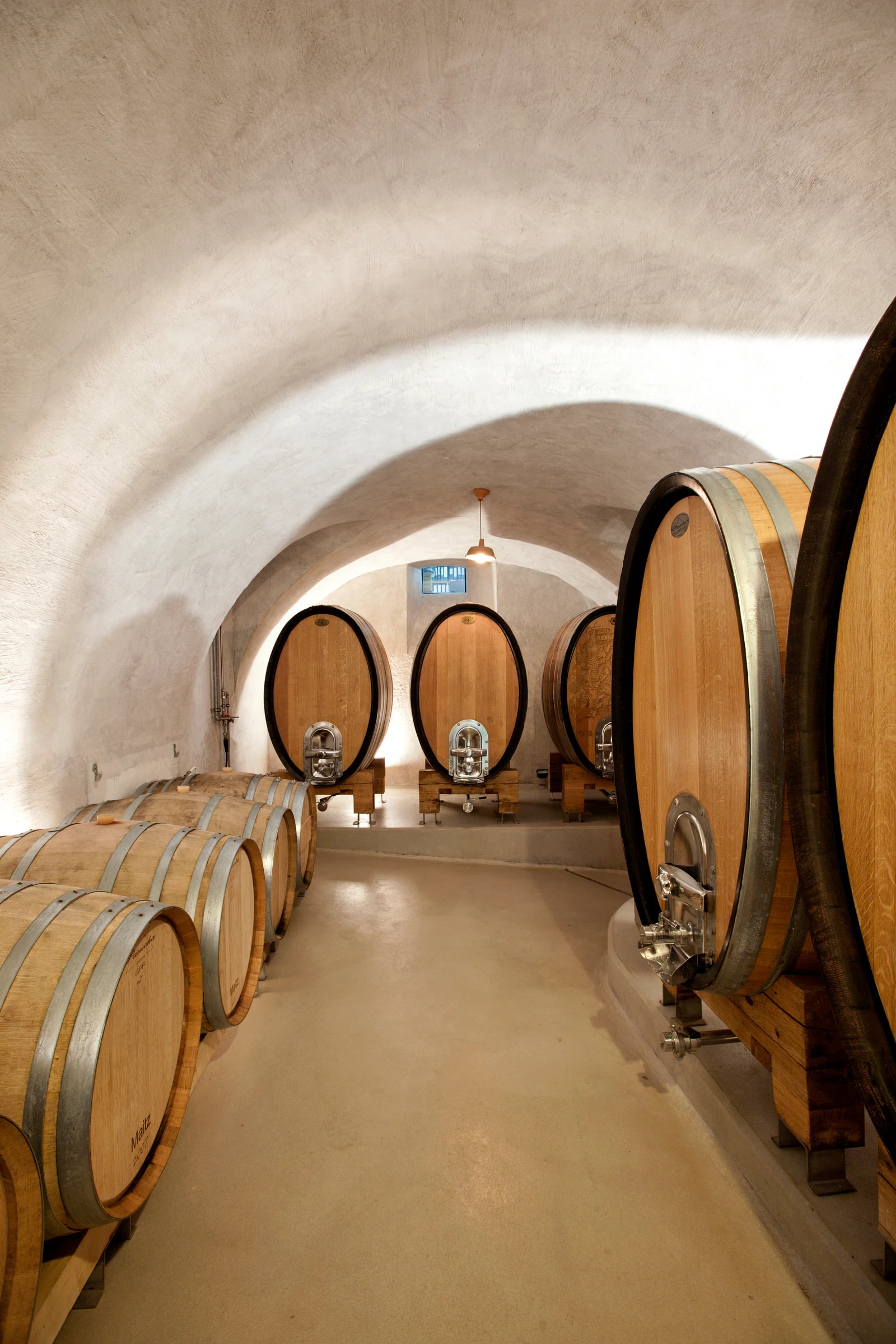 Vaulted cellar with wooden casks. Photo: Weingut Wolfgang Maitz