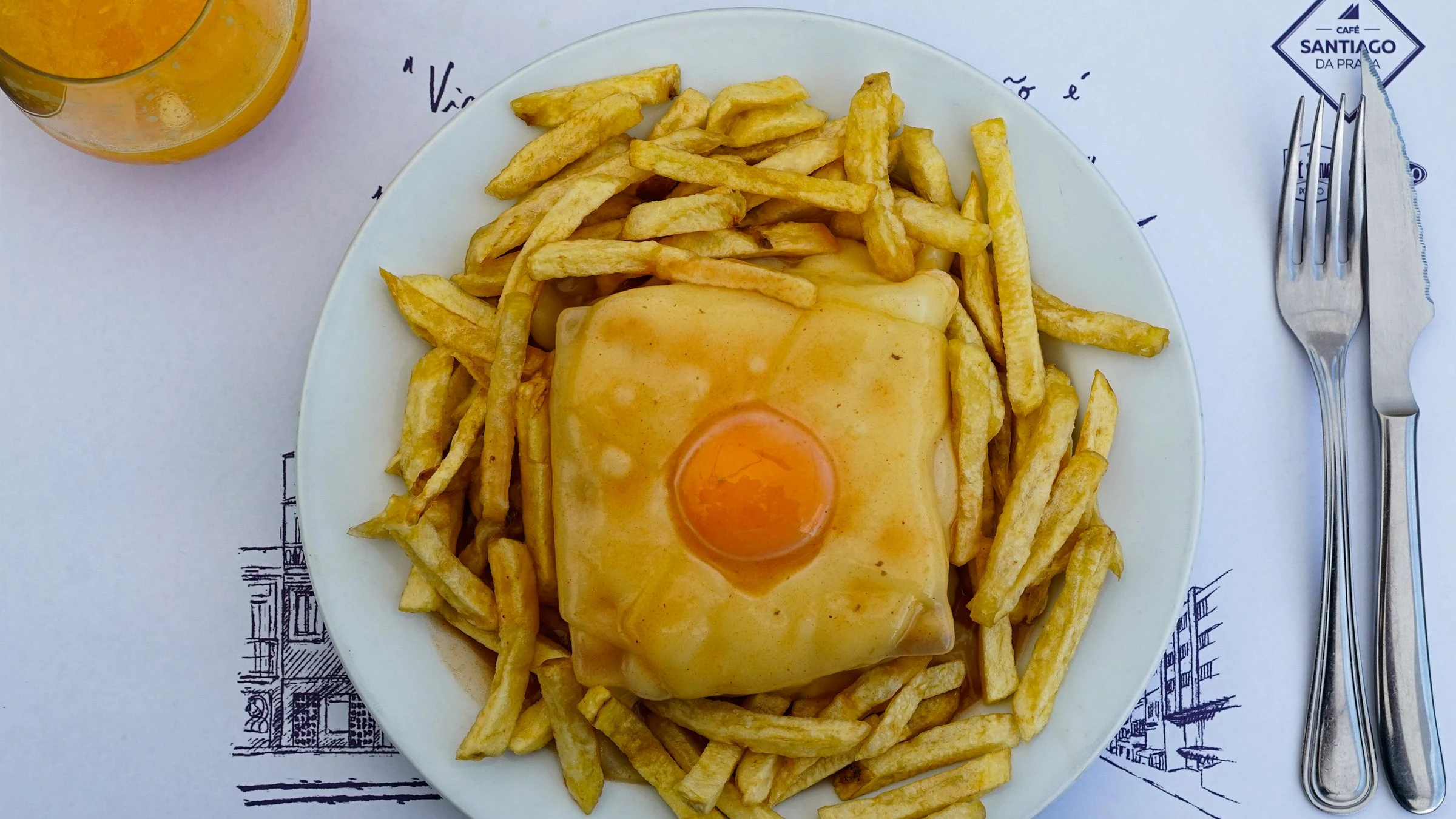 A francesinha, here at another café in the city: toasted bread with steak and sausage, covered in melted cheese and a spiced sauce. Bourdain ate his at O Afonso in 2017. Photo: Matheus De Moraes Gugelmim / Pexels