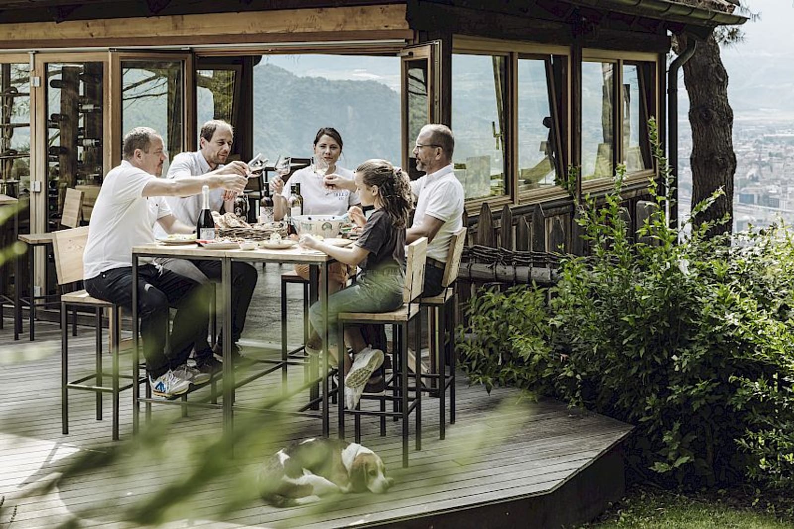 A long lunch with regional food and wine on a terrace with a mountain view